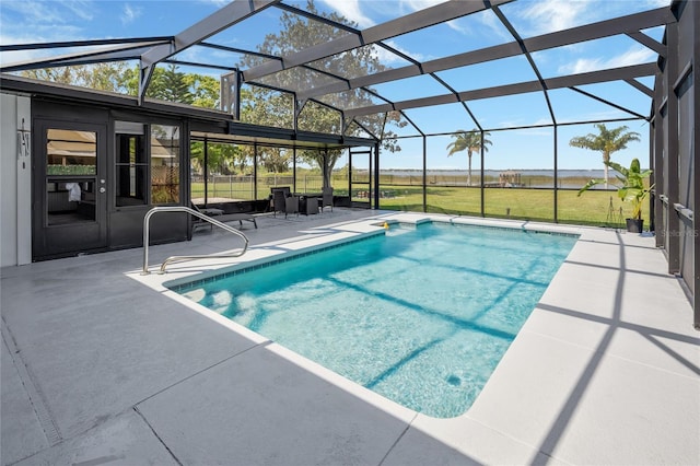 pool featuring glass enclosure and a patio area