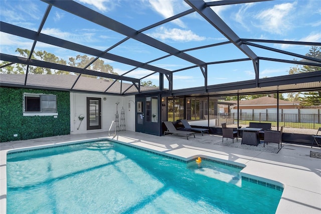 outdoor pool featuring an outdoor living space, glass enclosure, fence, and a patio area