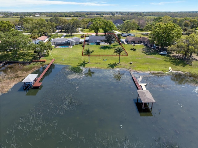 birds eye view of property featuring a water view