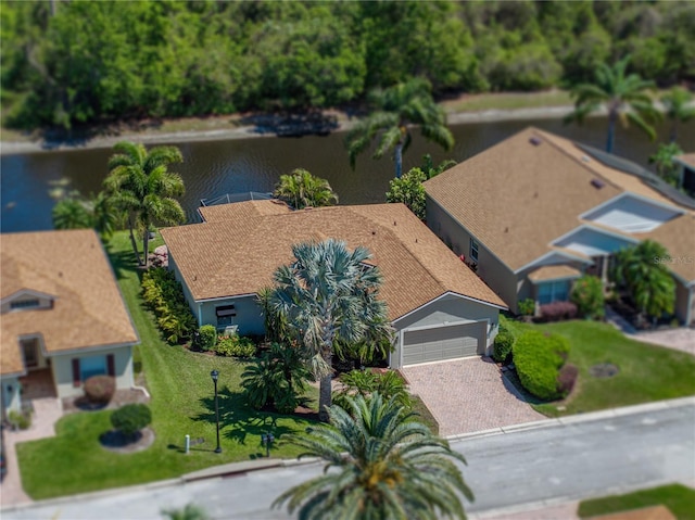 birds eye view of property with a water view