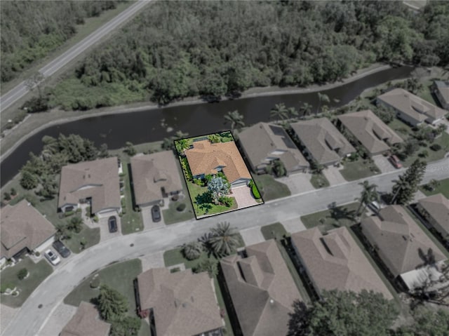 bird's eye view with a residential view and a water view