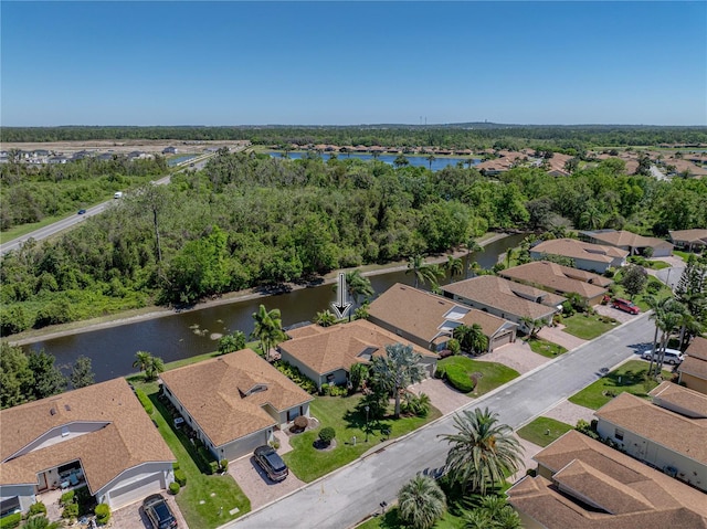 bird's eye view with a residential view and a water view