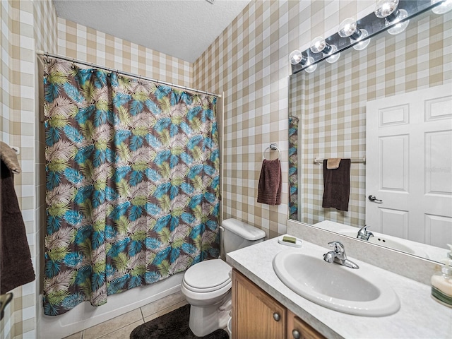 full bathroom featuring tile patterned floors, toilet, a textured ceiling, wallpapered walls, and shower / bath combination with curtain