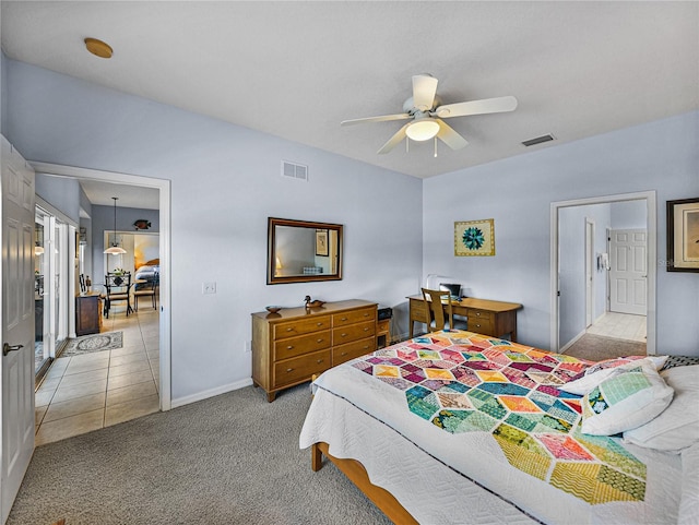 bedroom with a ceiling fan, light tile patterned flooring, light colored carpet, and visible vents