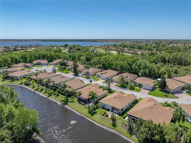 bird's eye view featuring a residential view and a water view