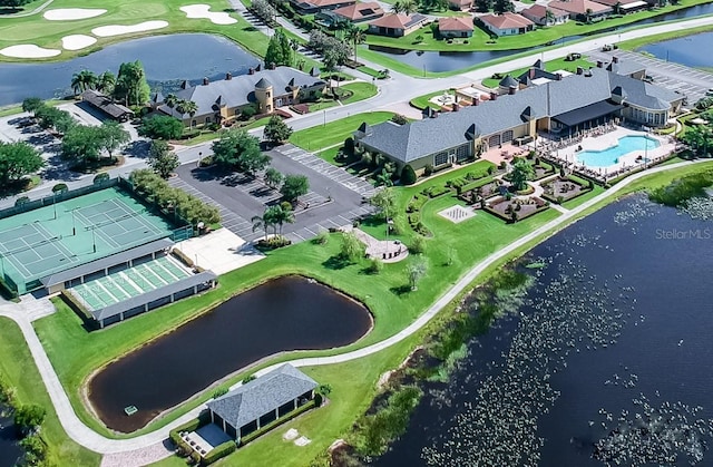drone / aerial view with a residential view and a water view