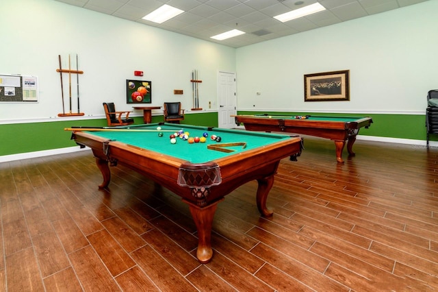 rec room featuring pool table, wood finished floors, and a paneled ceiling