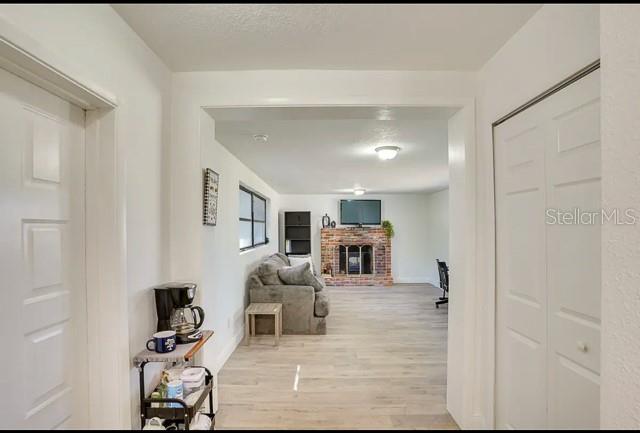 hall with wood finished floors