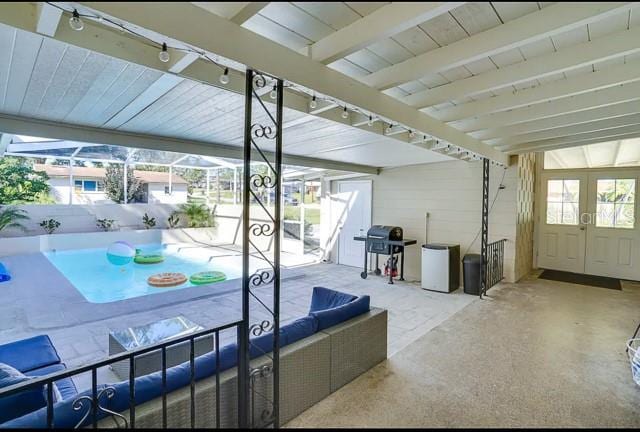 view of patio featuring french doors and a grill