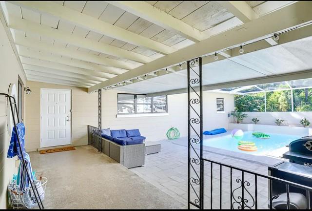 view of patio with a lanai