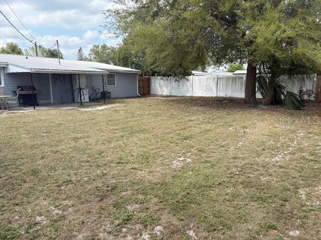 view of yard featuring a patio and fence