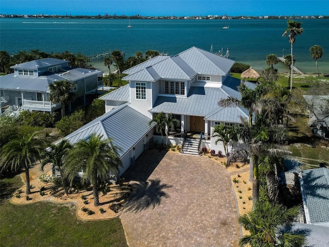 birds eye view of property with a water view