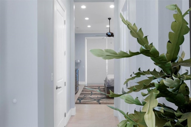 hall with recessed lighting, baseboards, and light wood-style floors