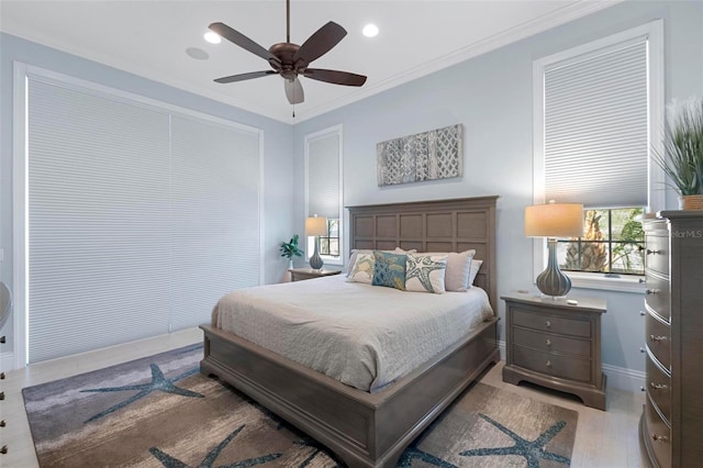 bedroom with recessed lighting, multiple windows, crown molding, and a ceiling fan