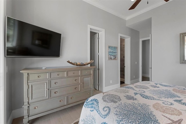 bedroom with a ceiling fan, baseboards, and ornamental molding