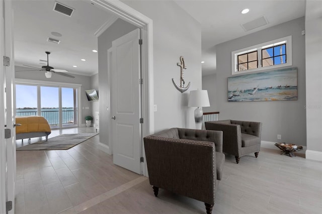 sitting room featuring light wood finished floors, visible vents, recessed lighting, and baseboards