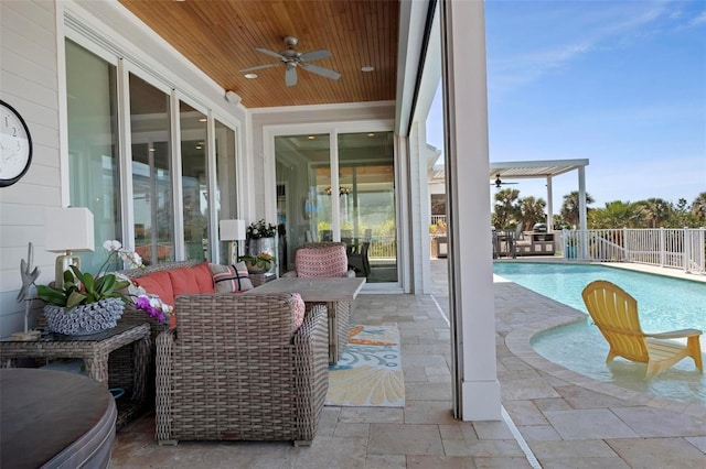 view of pool featuring fence, a patio area, a fenced in pool, and ceiling fan