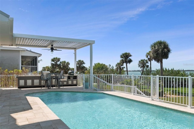 view of pool featuring a patio area, a fenced in pool, a ceiling fan, and fence