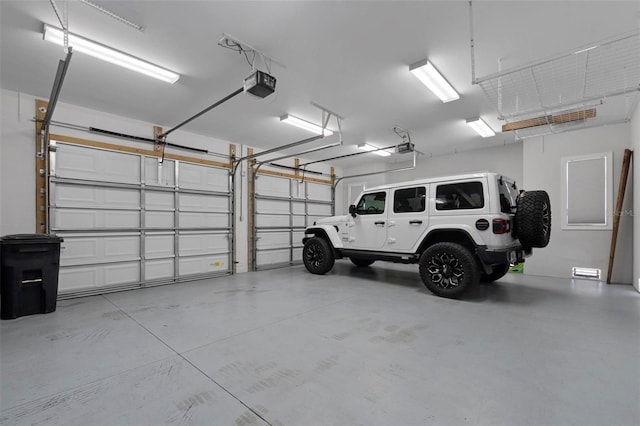 garage featuring a garage door opener