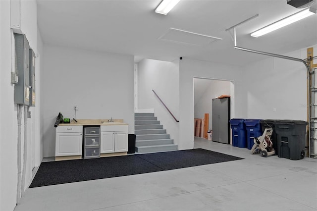 garage featuring a garage door opener and a sink