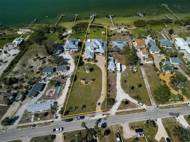 bird's eye view featuring a residential view and a water view