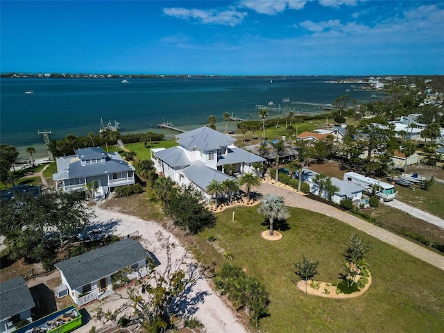 drone / aerial view featuring a residential view and a water view