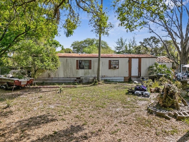 back of property featuring entry steps