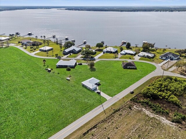 birds eye view of property with a residential view and a water view