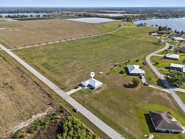 bird's eye view with a water view and a rural view