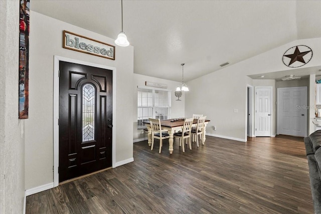 entrance foyer featuring dark wood finished floors, lofted ceiling, baseboards, and visible vents