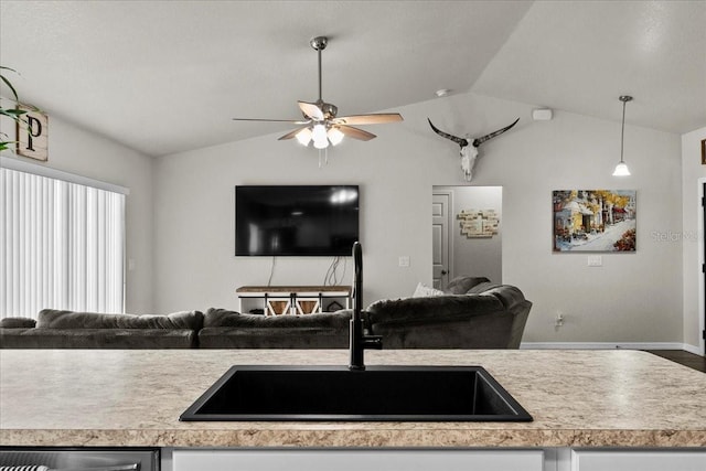 kitchen featuring a sink, stainless steel dishwasher, open floor plan, light countertops, and lofted ceiling