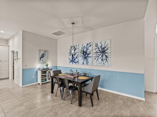 dining area featuring visible vents and baseboards