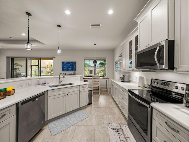 kitchen with visible vents, recessed lighting, a sink, stainless steel appliances, and light countertops