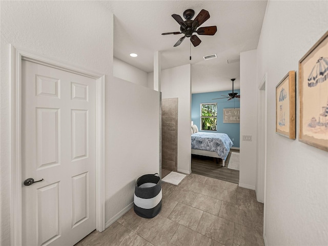 full bathroom featuring ceiling fan, baseboards, visible vents, and connected bathroom