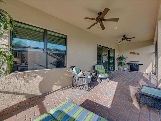 view of patio featuring a ceiling fan