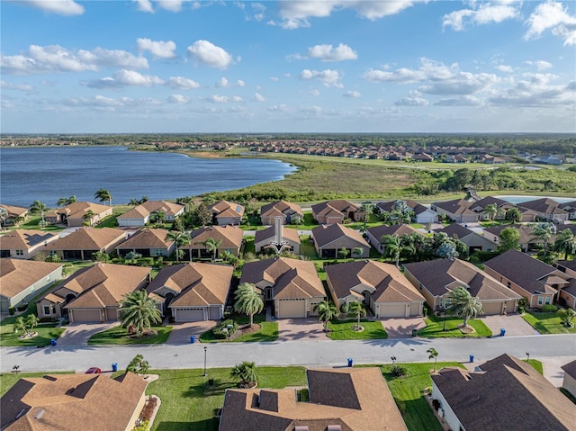 aerial view featuring a residential view and a water view