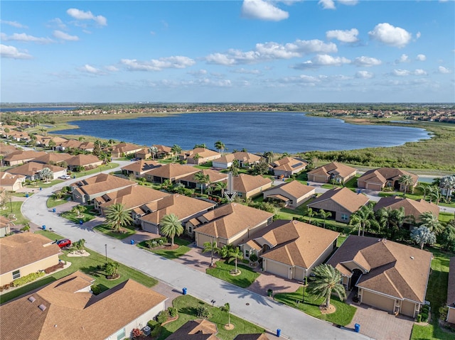 birds eye view of property with a residential view and a water view