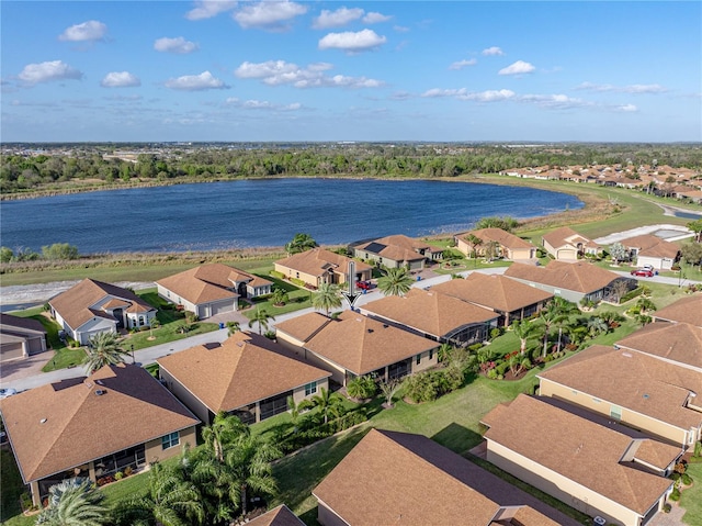 drone / aerial view featuring a residential view and a water view