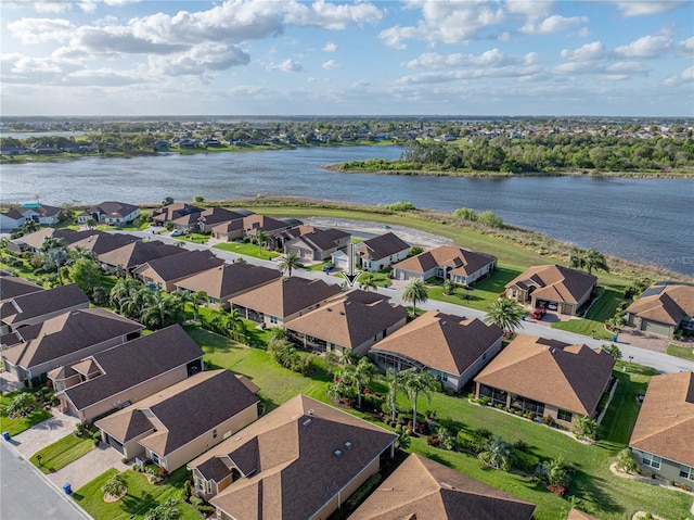 bird's eye view with a residential view and a water view