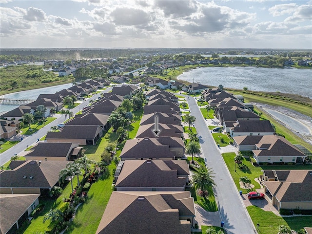 birds eye view of property featuring a residential view and a water view