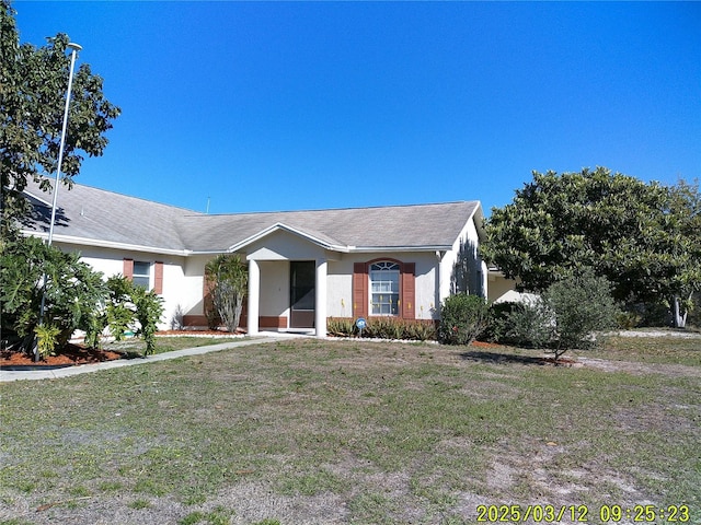 ranch-style house with a front yard