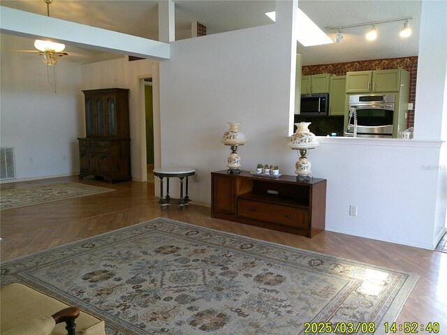 interior space featuring visible vents and wood finished floors