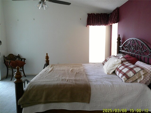 carpeted bedroom featuring a ceiling fan