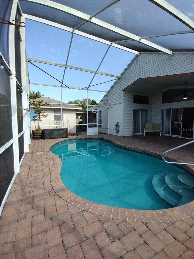 outdoor pool featuring a patio and a lanai