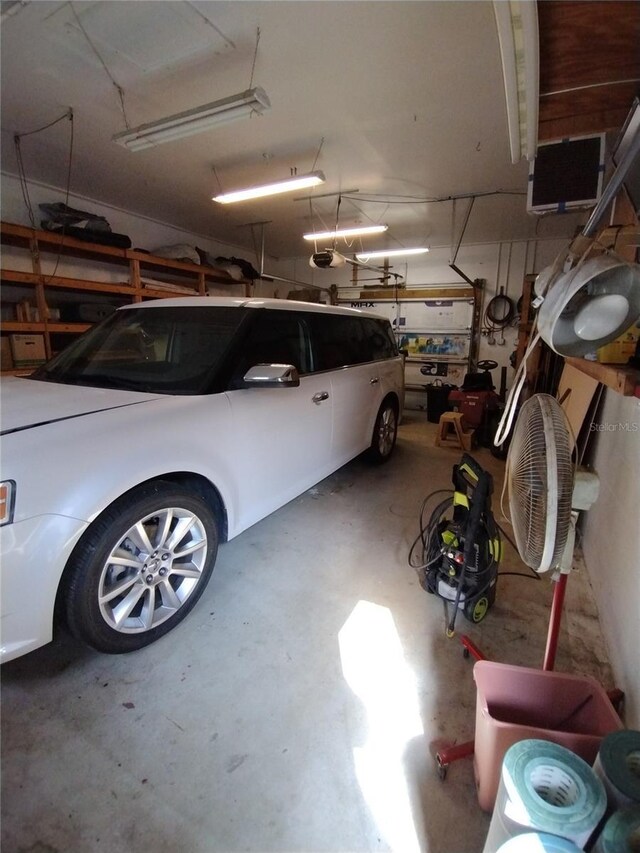 garage featuring a garage door opener