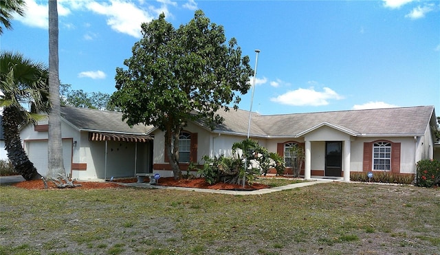 ranch-style house with a front yard, roof with shingles, a garage, and stucco siding