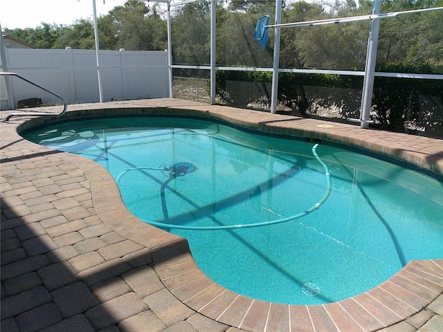 view of pool with a lanai and a fenced in pool