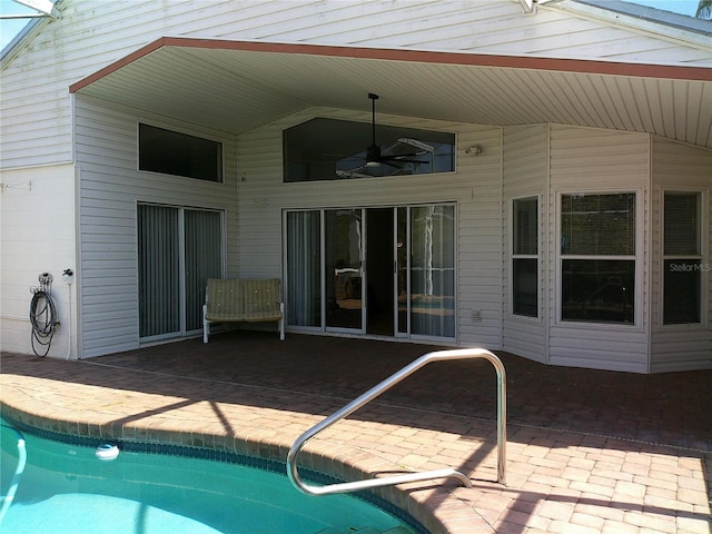 pool with a patio area and ceiling fan