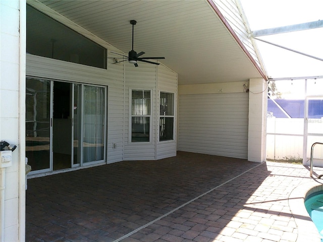 view of patio with a ceiling fan, a lanai, and a fenced in pool