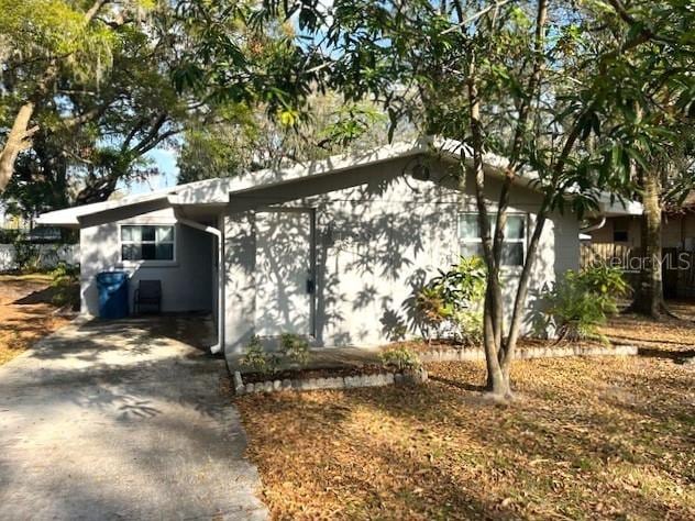 view of property exterior featuring driveway